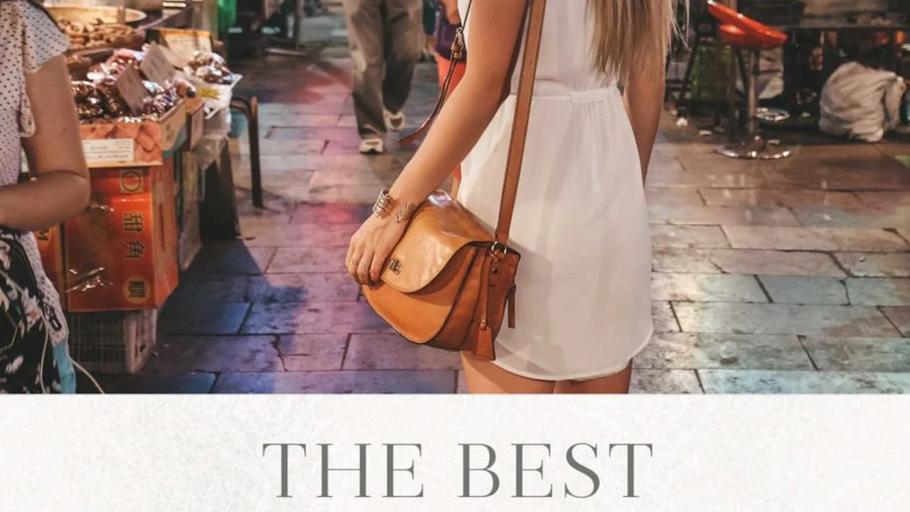 Close up on a plate of mashed potatoes, topped with baked pork chops with cream of mushroom soup, and a side of green beans.