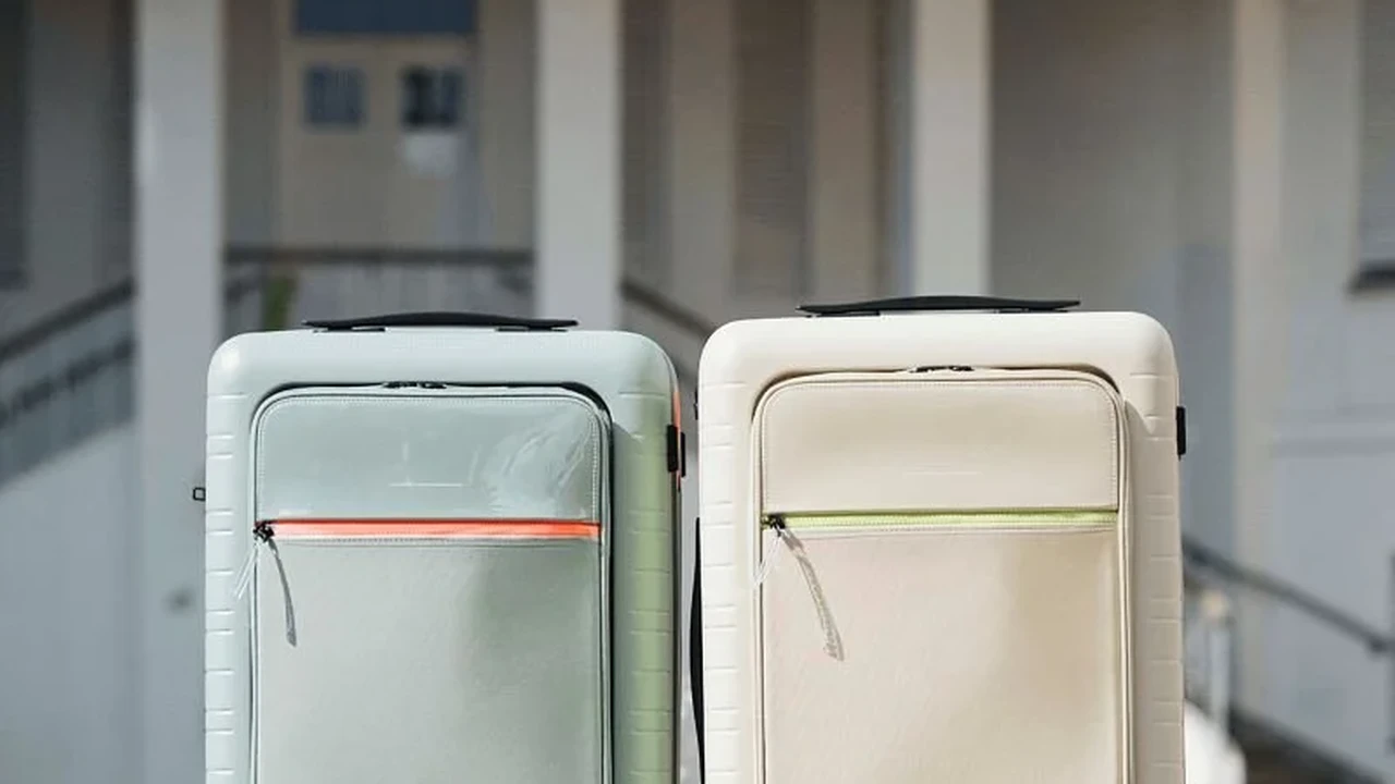 Close up on a plate of mashed potatoes, topped with baked pork chops with cream of mushroom soup, and a side of green beans.