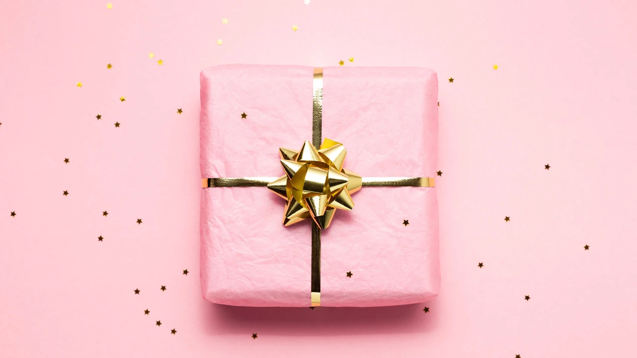 Close up on a plate of mashed potatoes, topped with baked pork chops with cream of mushroom soup, and a side of green beans.