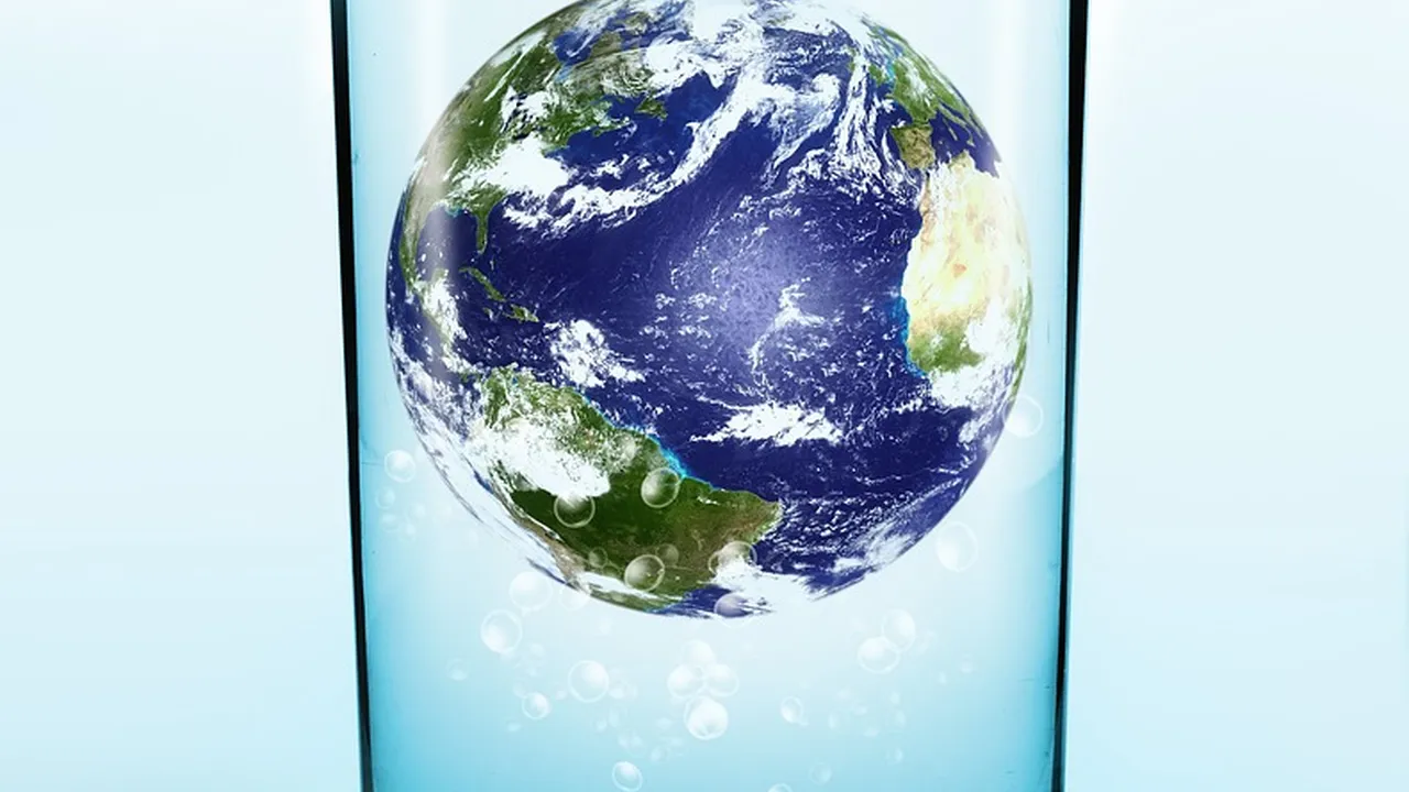 Close up on a plate of mashed potatoes, topped with baked pork chops with cream of mushroom soup, and a side of green beans.