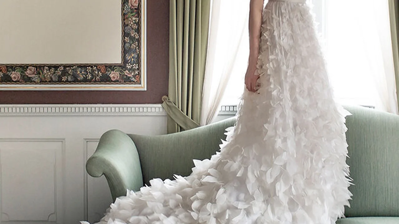 Close up on a plate of mashed potatoes, topped with baked pork chops with cream of mushroom soup, and a side of green beans.