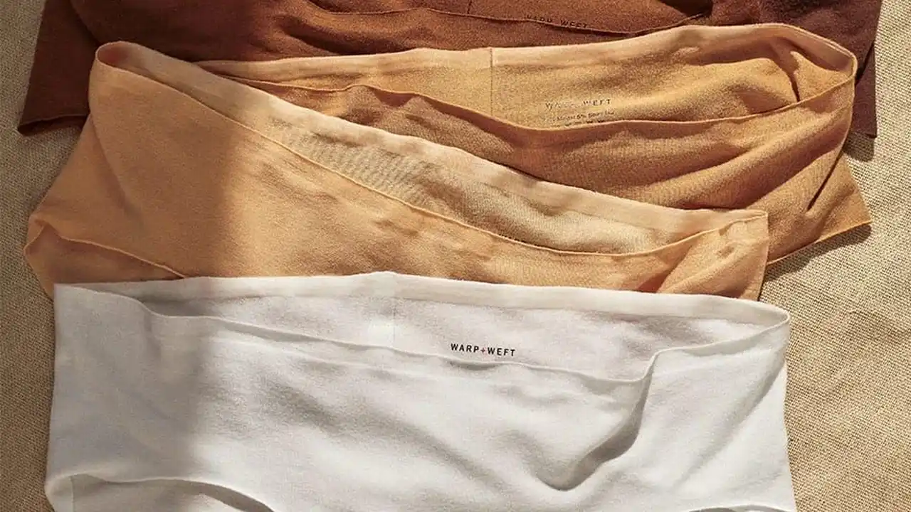 Close up on a plate of mashed potatoes, topped with baked pork chops with cream of mushroom soup, and a side of green beans.